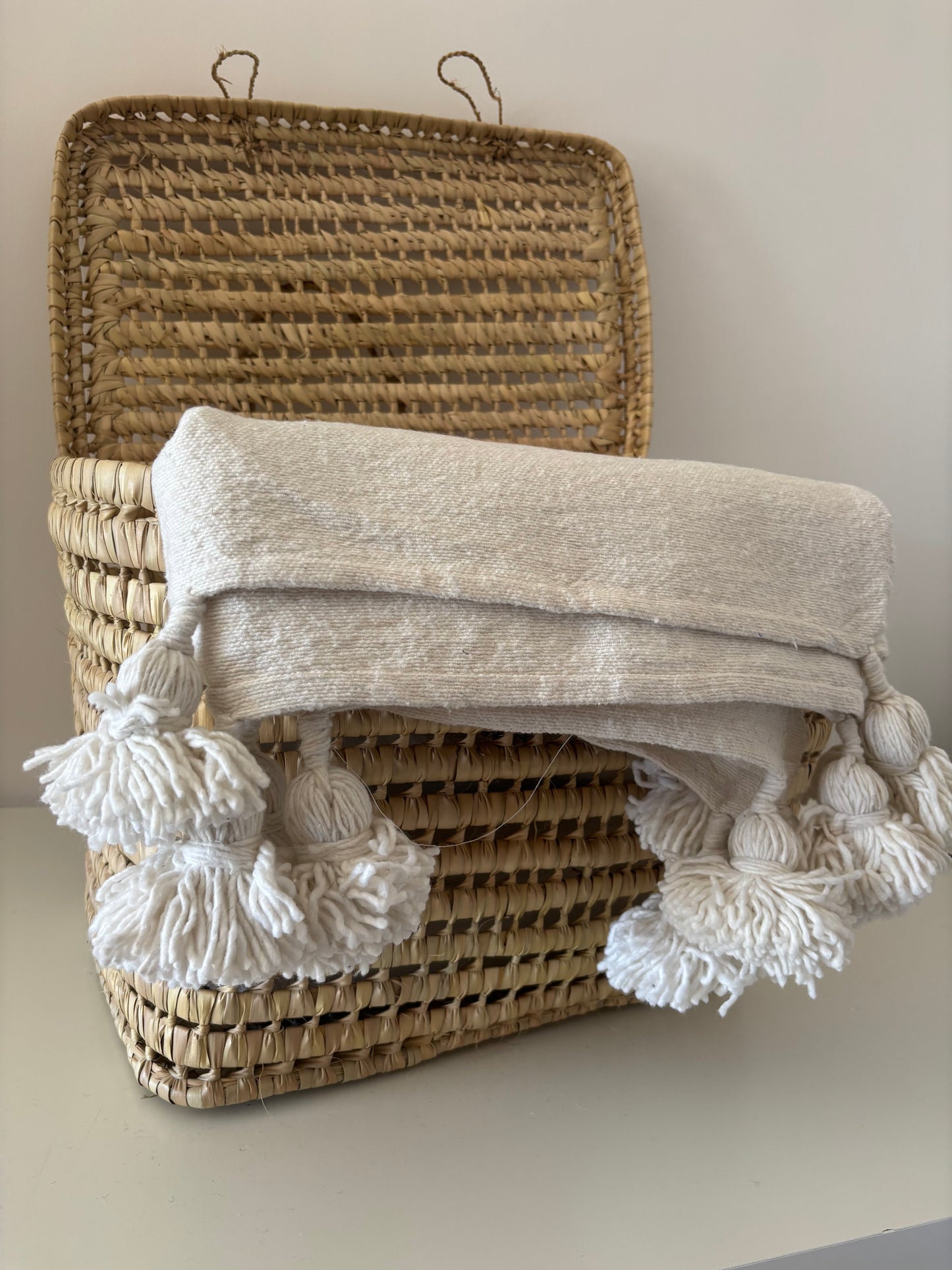 PLAID A POMPOM COULEUR UNI